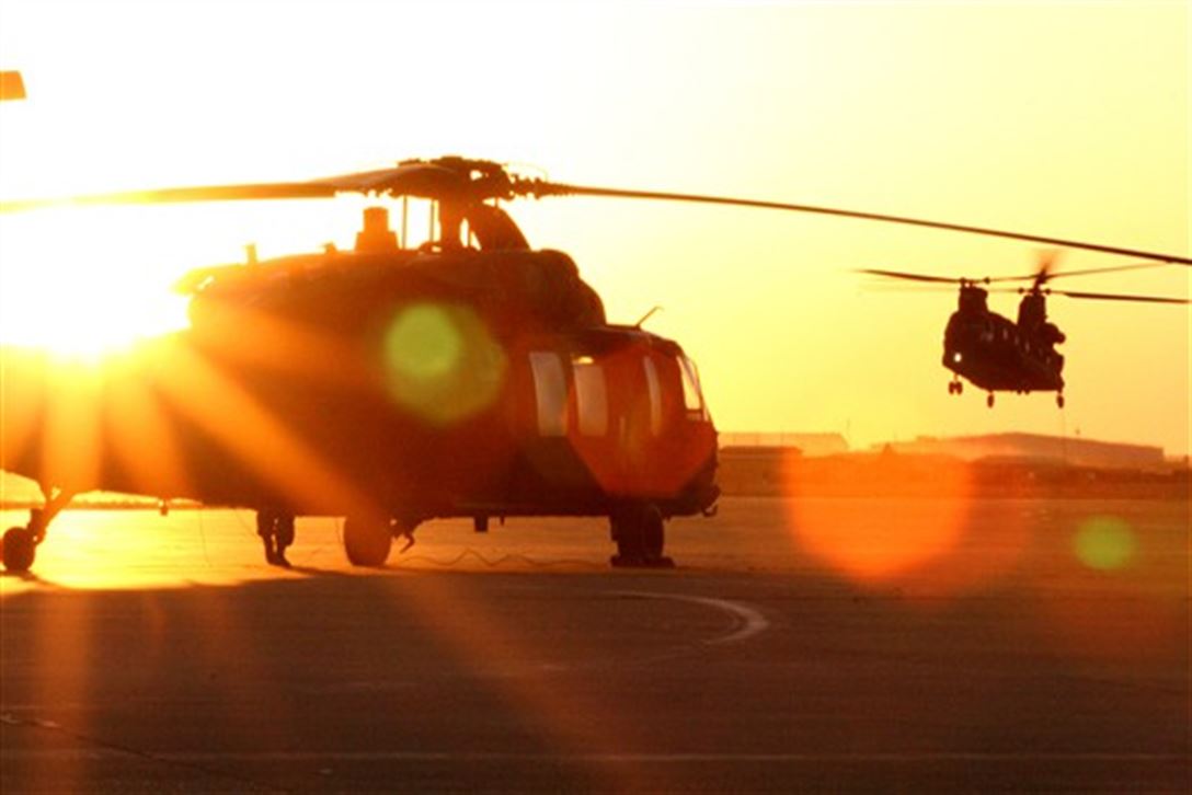 Military helicopter at sunset