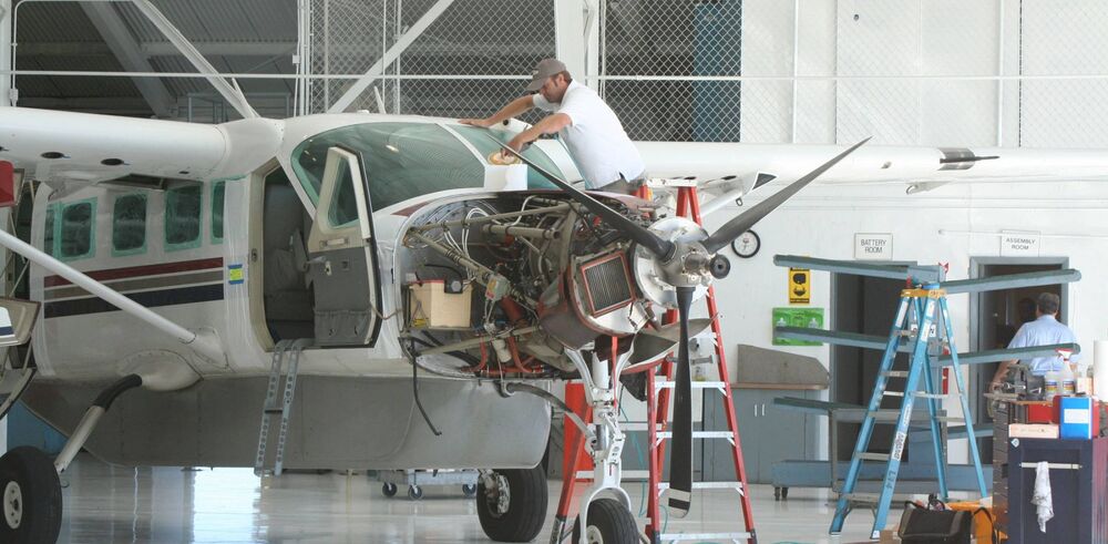 Turboprop aircraft under maintenance in a hangar